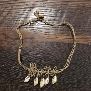 Vintage handmade bohemian-style necklace made of natural fibers and small shells